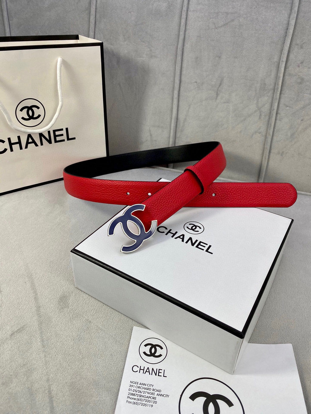 CHANEL 30MM BELT IN CHERRY RED GRAINED CALFSKIN WITH NAVY BLUE METAL LOGO