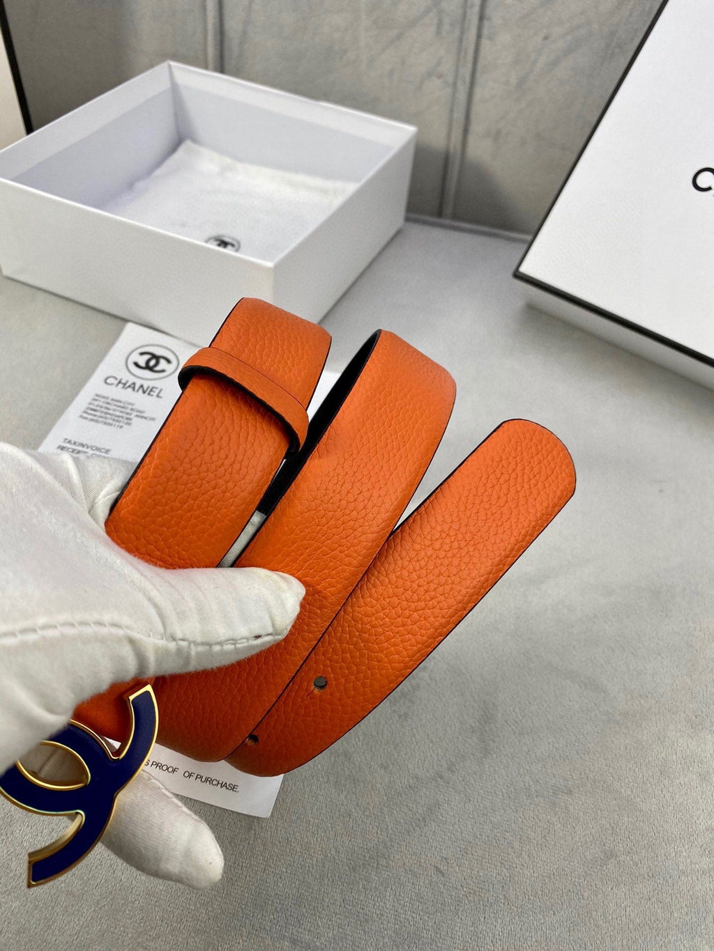 CHANEL 30MM BELT IN FIRE ORANGE GRAINED CALFSKIN WITH NAVY BLUE METAL LOGO