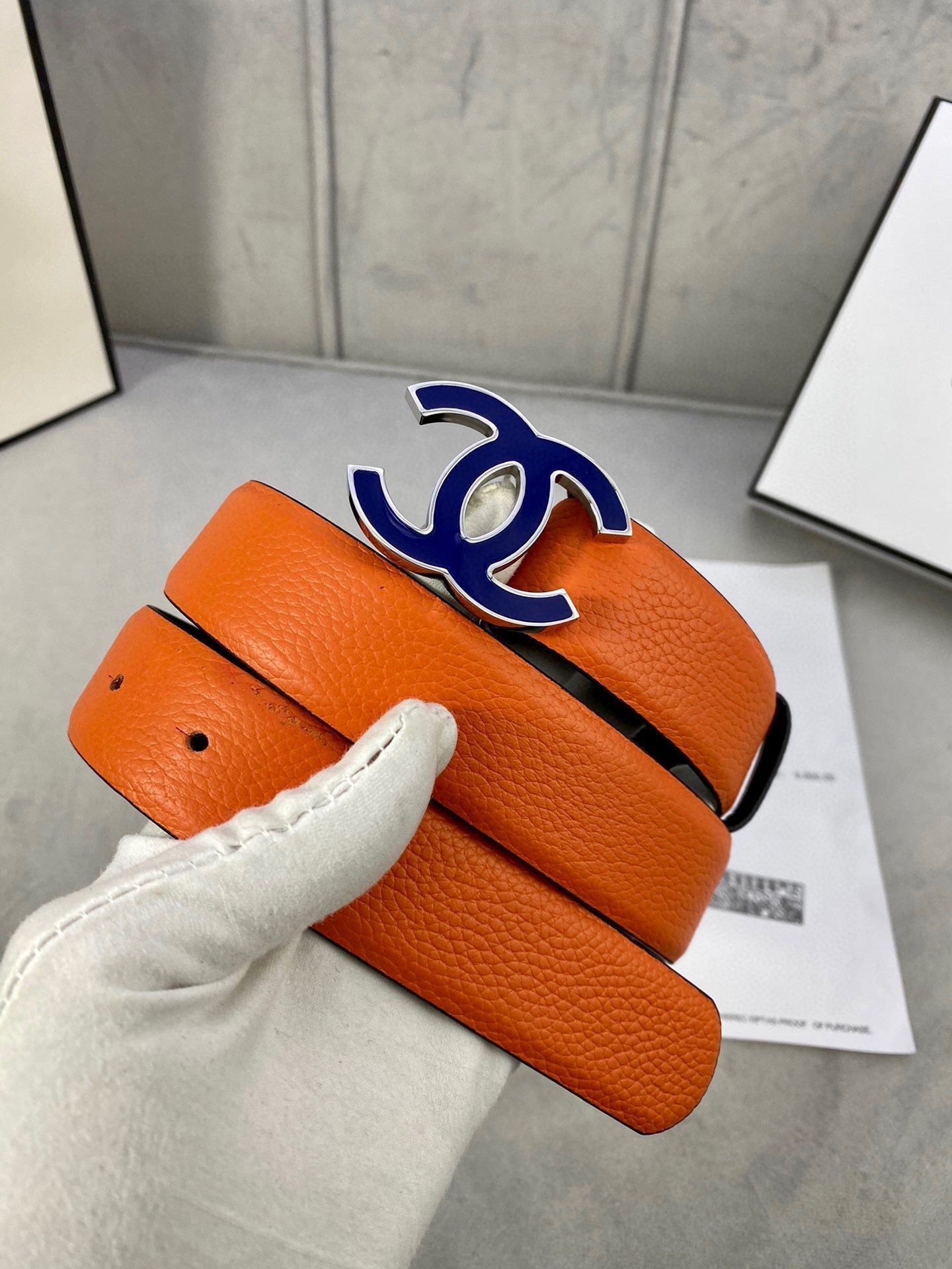 CHANEL 30MM BELT IN FIRE ORANGE GRAINED CALFSKIN WITH NAVY BLUE METAL LOGO