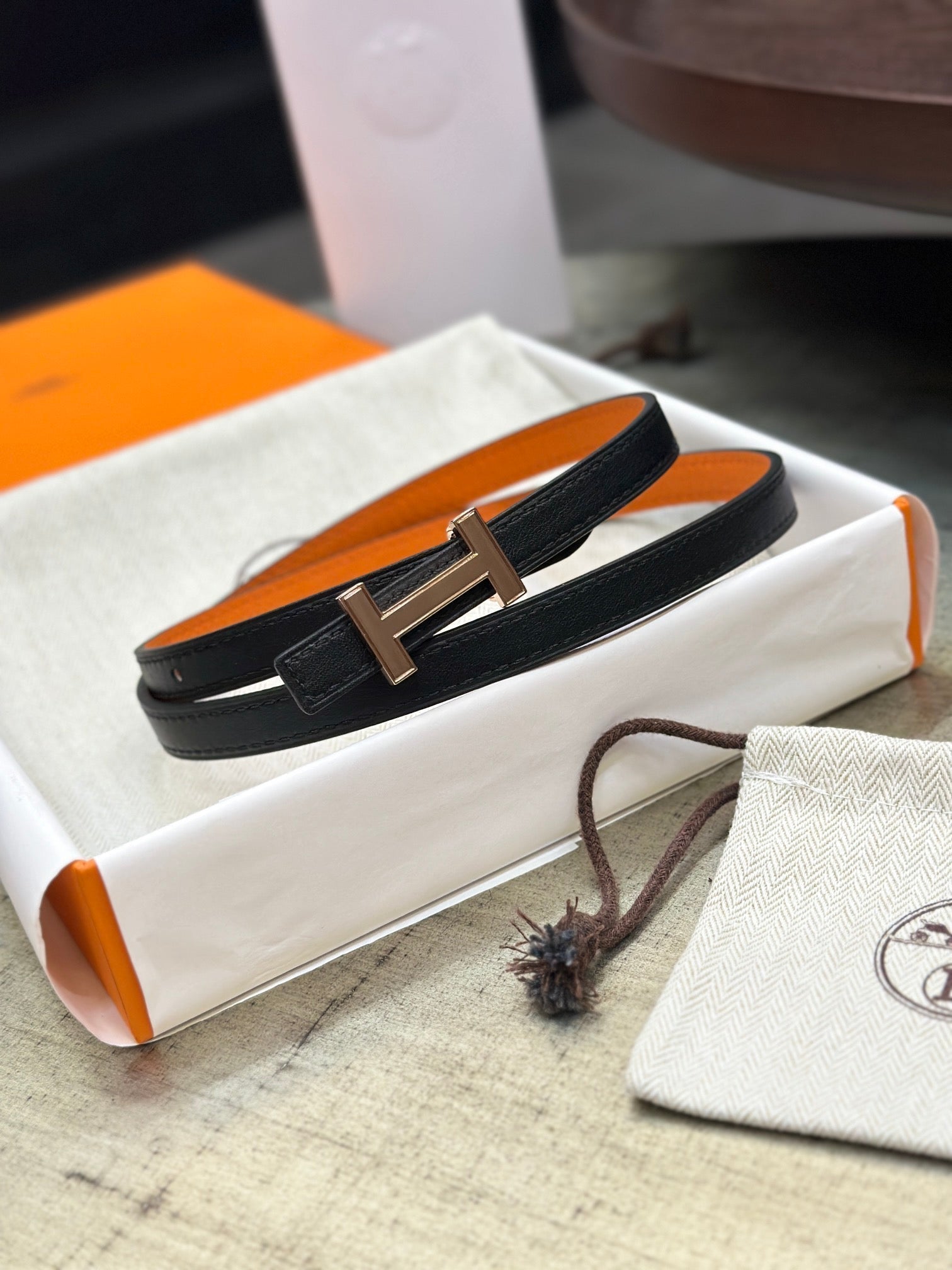 HERMES FOCUS BUCKLE & REVERSIBLE BLACK AND ORANGE LEATHER STRAP 13MM COPPER HARDWARE