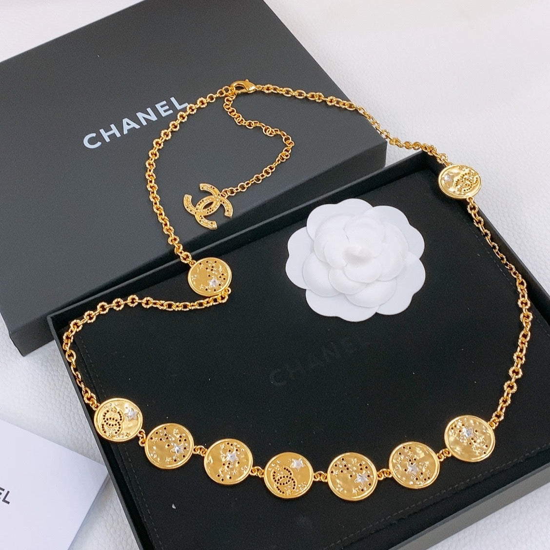 CHANEL TWISTED CHAIN BELT WITH RHINESTONES AND LOGO PLATE IN GOLD TONE